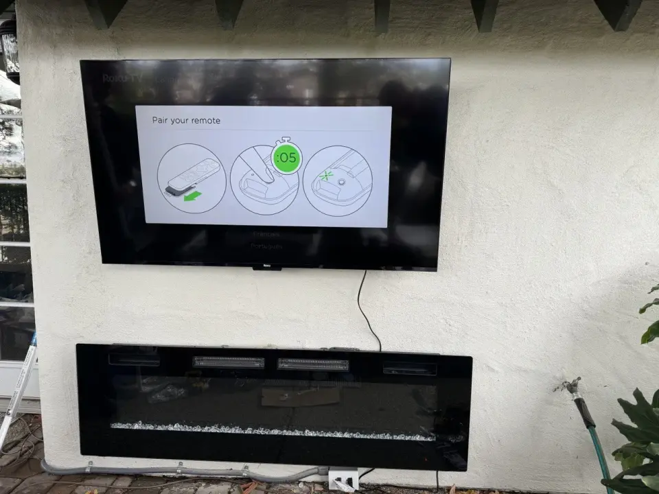 Outdoor TV mount with electric fireplace
