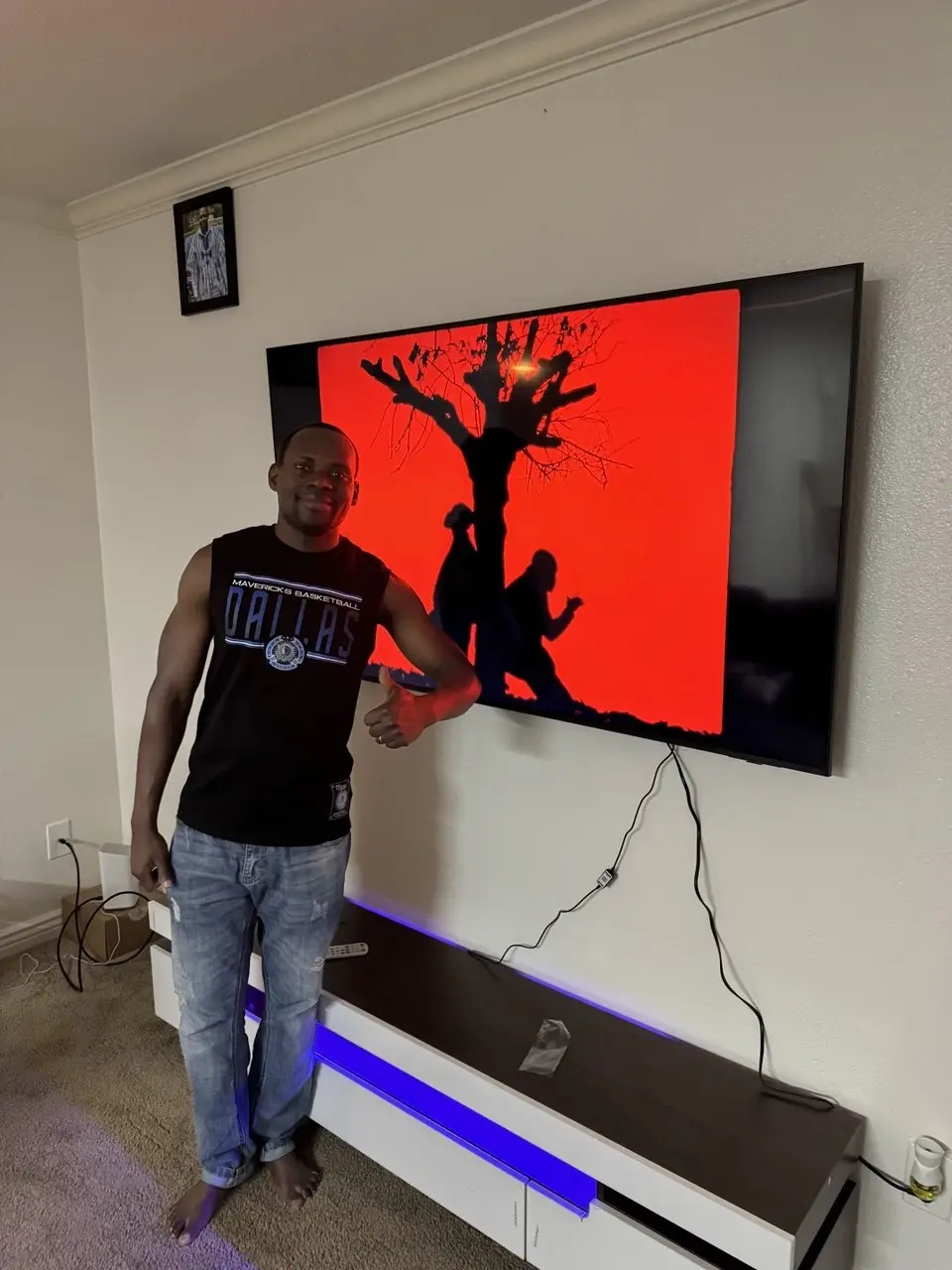 Happy client with large TV mount